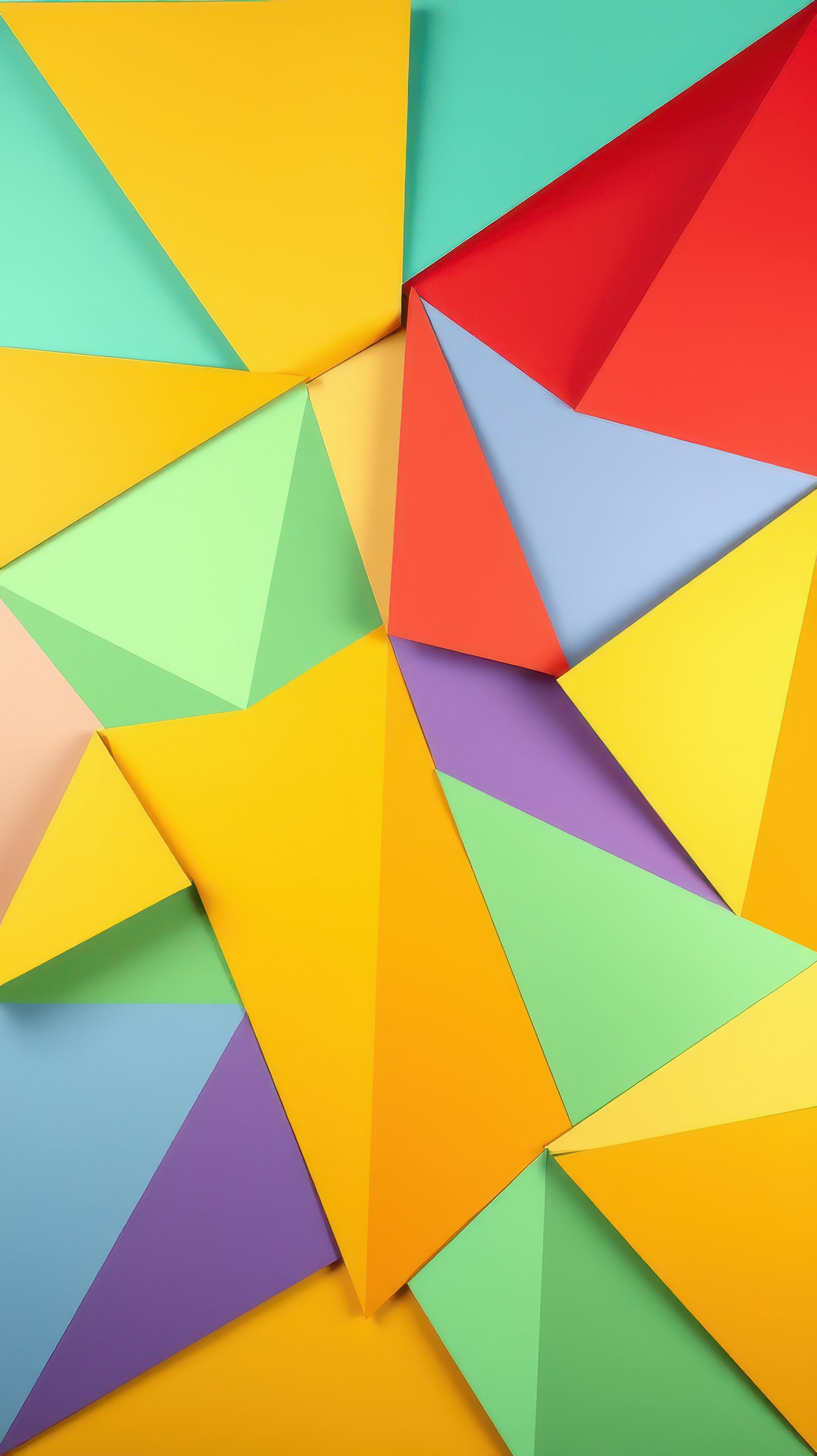Colorful geometric paper shapes arranged creatively on a flat surface for artistic expression